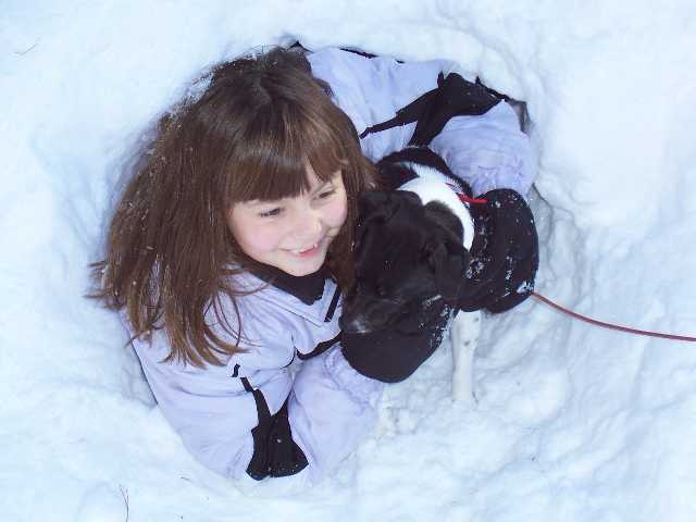 Girls in snow tunnel